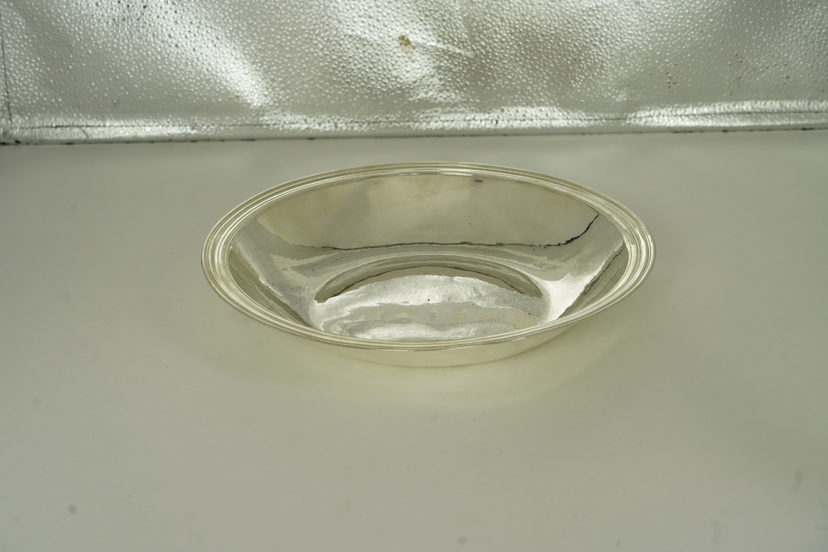 A rare late Charles II silver circular deep plate, makers mark 'D' (Jackson's reference P.139)